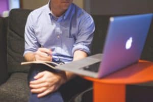 man-notes-macbook-computer-medium